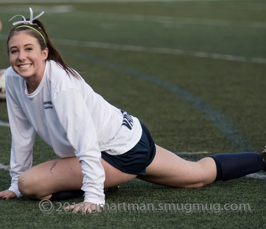 Pre-game stretch with captain Teagan McNamee