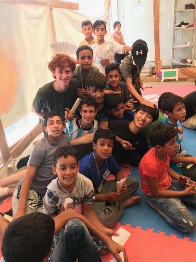 Jack Burns having fun with Syrian refugee children.