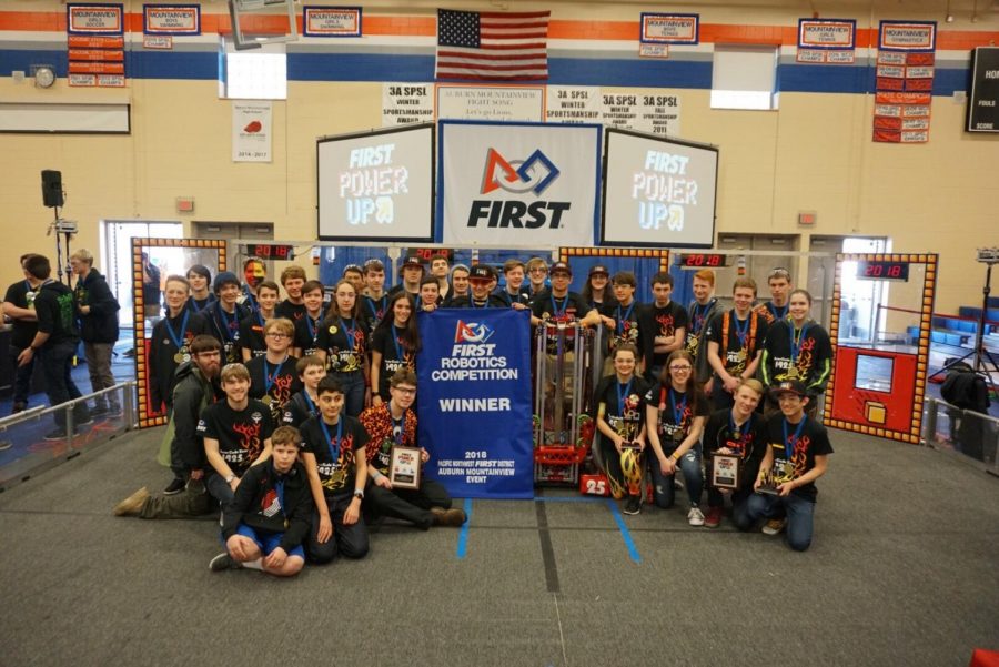 The+robotics+team+poses+with+a+first+place+finish+at+their+Auburn+Mountainside+competition.+Each+member+works+diligently+to+ensure+the+robots+run+smoothly%21