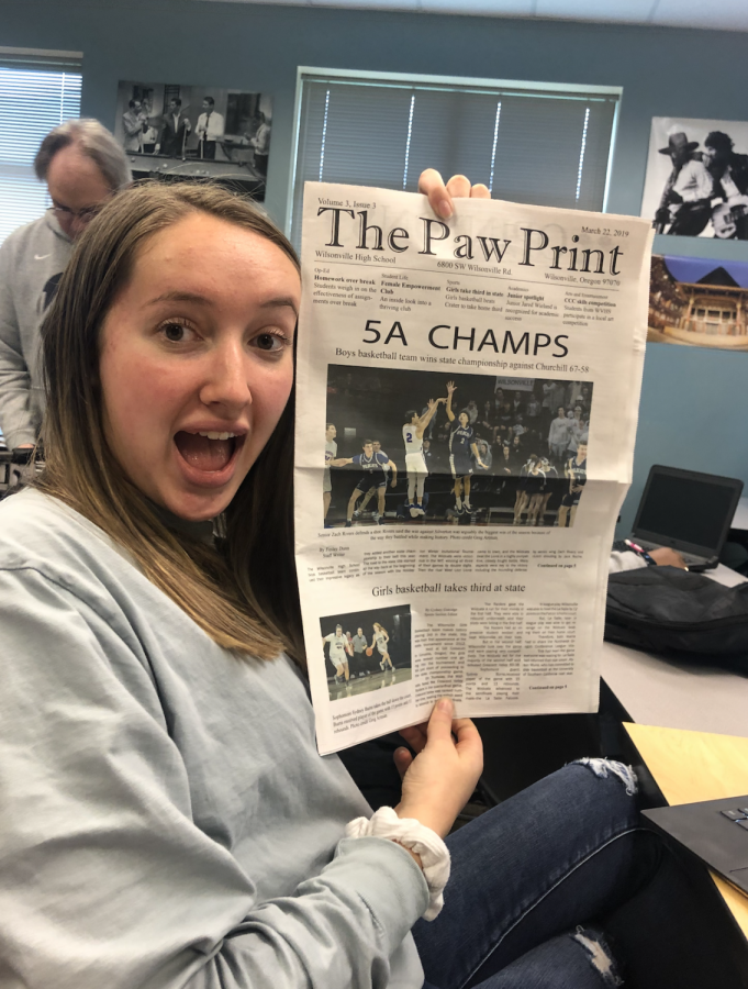 Ally Finkbeiner poses with the newspaper.