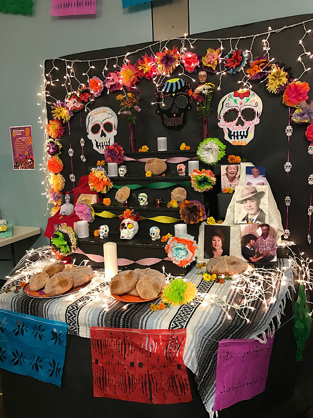 Food and art adorn this Day of the Dead display