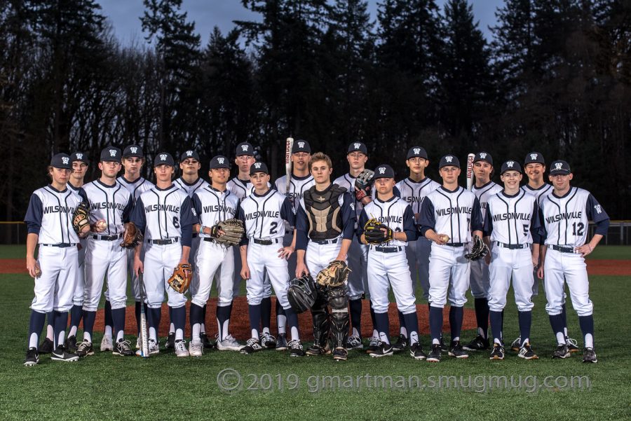 The baseball team poses for a group photo. Credit Greg Artman