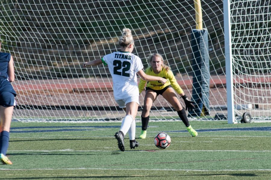 West Salem forward Paige Alexander takes on senior goalie Kendall Taylor. Alexander went on to win the OSAA Athlete of the Week after this performance.