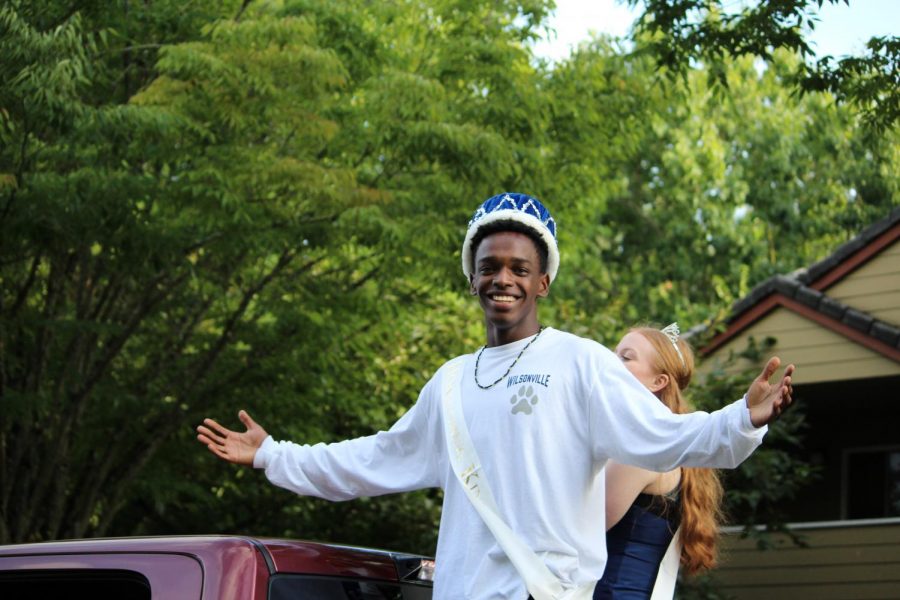 Nathan Harmitt poses for a picture during the parade. Nathan won homecoming at the assembly earlier in the day. 