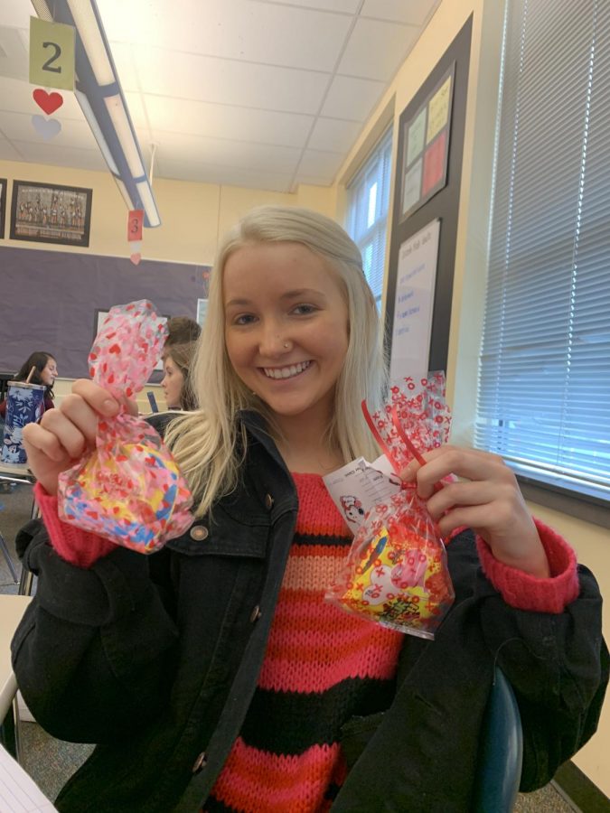 Senior Catie Stamnes holding two candygrams she recieved this Valentines Day. Photo credit Emily Swenson.