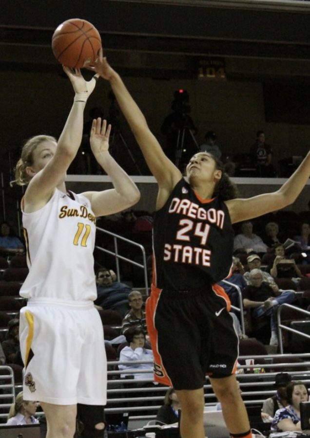 Alyssa Martin blocks a shot from an Arizona State player in the 2011 Pac-12 Tournament. 2011 was Scott Ruecks first of ten years at Oregon State.