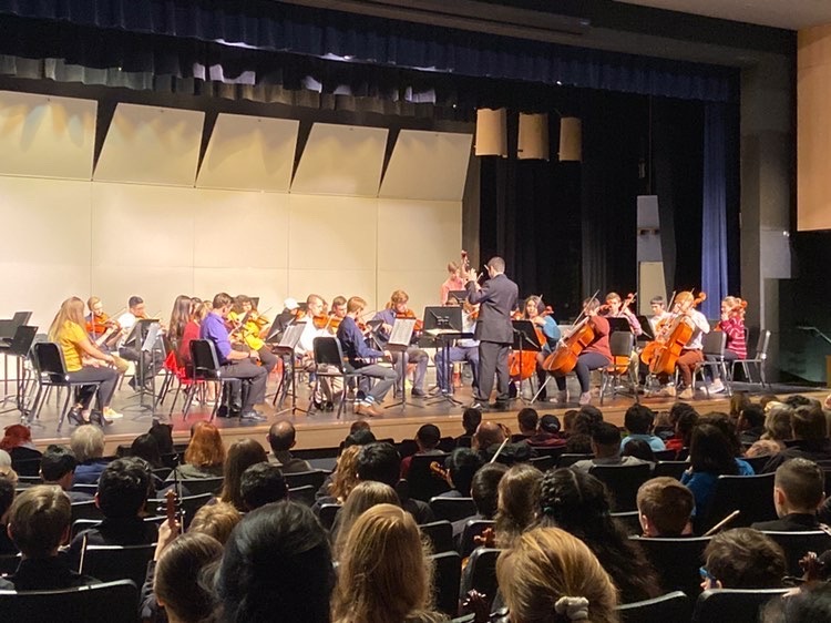The orchestra class from last year performing at one of their concerts. Band and orchestra are hoping to release recordings of songs to make up for not being able to hold concerts.