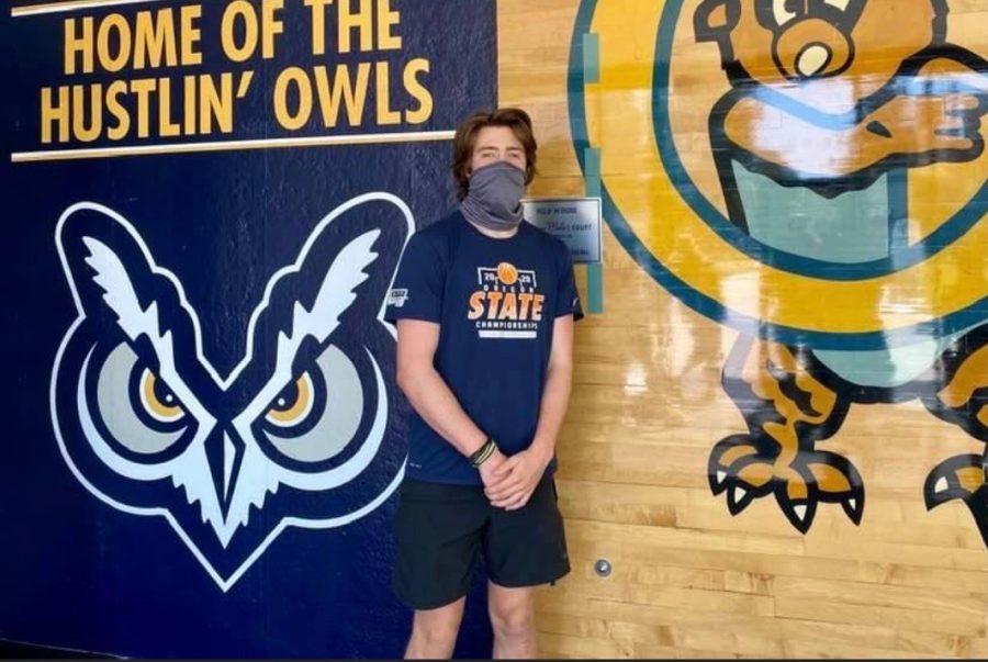 Keegan Shivers at college standing in front of the famous Hooty the owl. Keegan is one of the many young adults to get COVID at college.