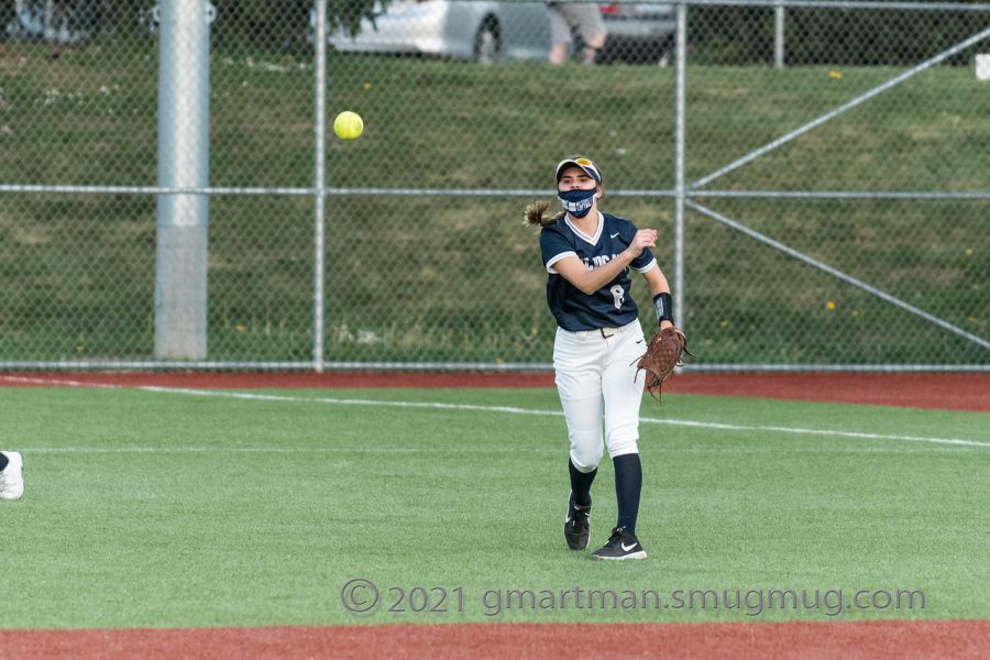 Natalie Adams, junior, releasing the ball to throw back to the infield.