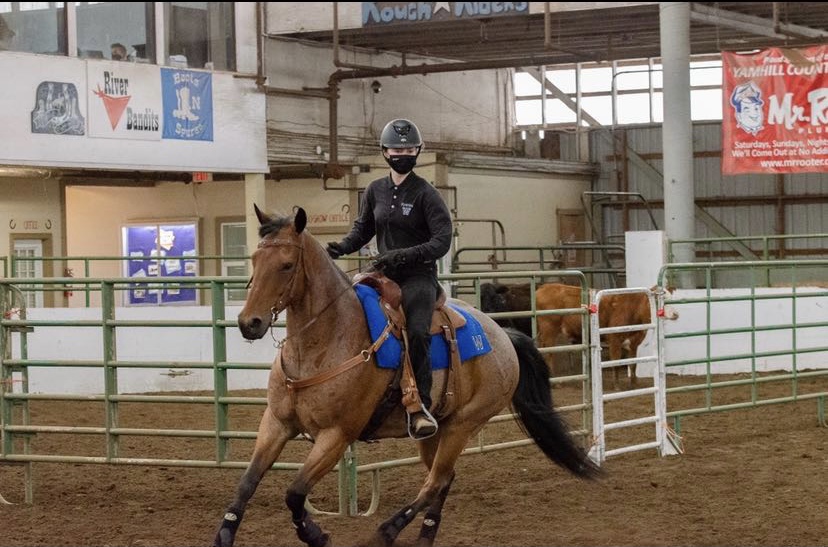Katrina Brisbois competes on her horse in the equestrian meet placing fourth in reining!