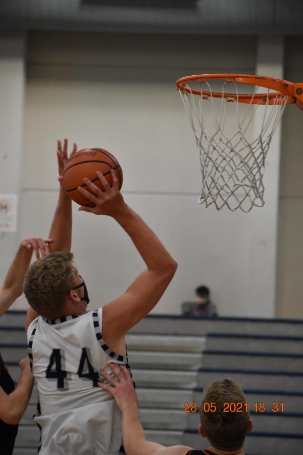 Logan Thieby up close and personal with the rim as he gets the bucket.