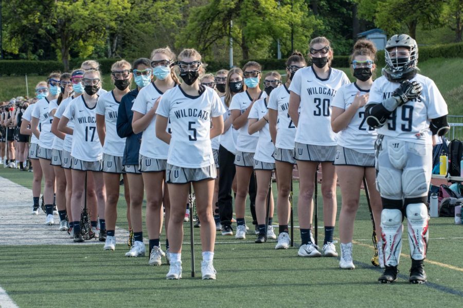The Wilsonville girls lacrosse team during the national anthem.