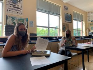 Seniors Maddy DuQuette and Mikayla Brehm work at an AP Biology study group. Both are well versed in many AP classes and share their opinions on their experiences.