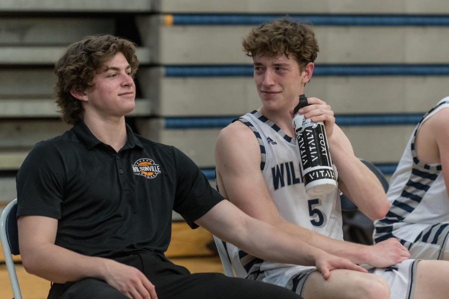 Junior Kellen Hartford and Senior Riley Scanlan share an intimate moment on the  bench. 