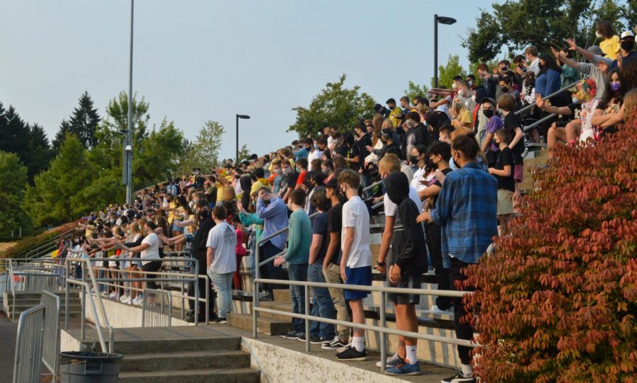 The incoming freshman gather in the bleachers for their introductory gathering before heading into real high school.