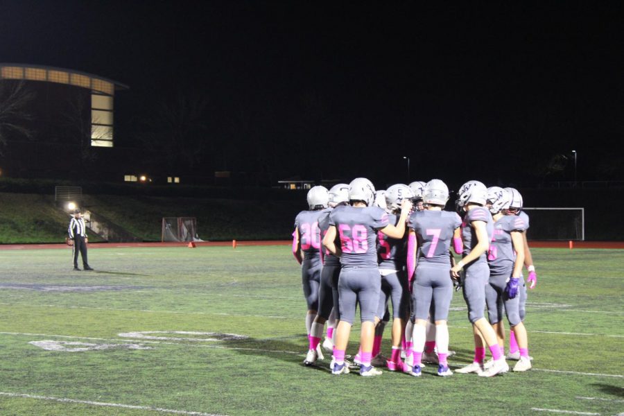 Senior+night+football.+The+team+huddles+together+for+one+of+the+last+times+on+their+home+field.