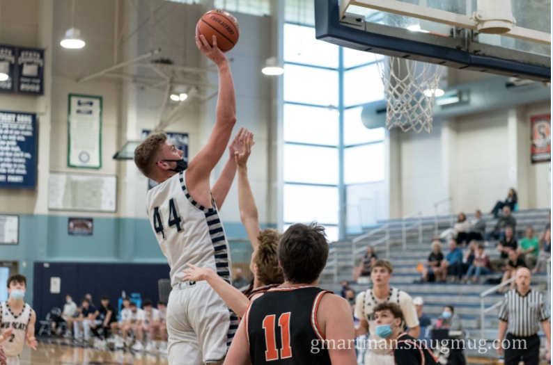 Logan Thebiay goes up for a jump shot in a varsity game this past season. 