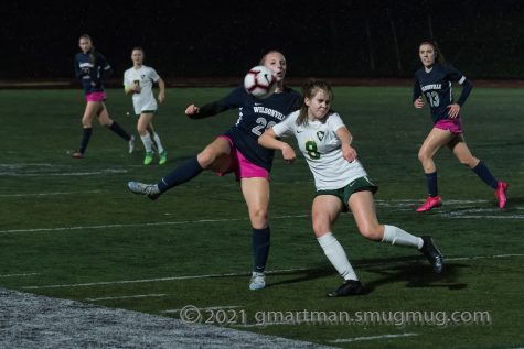 Campbell Lawler battles to keep the ball for Wilsonville.