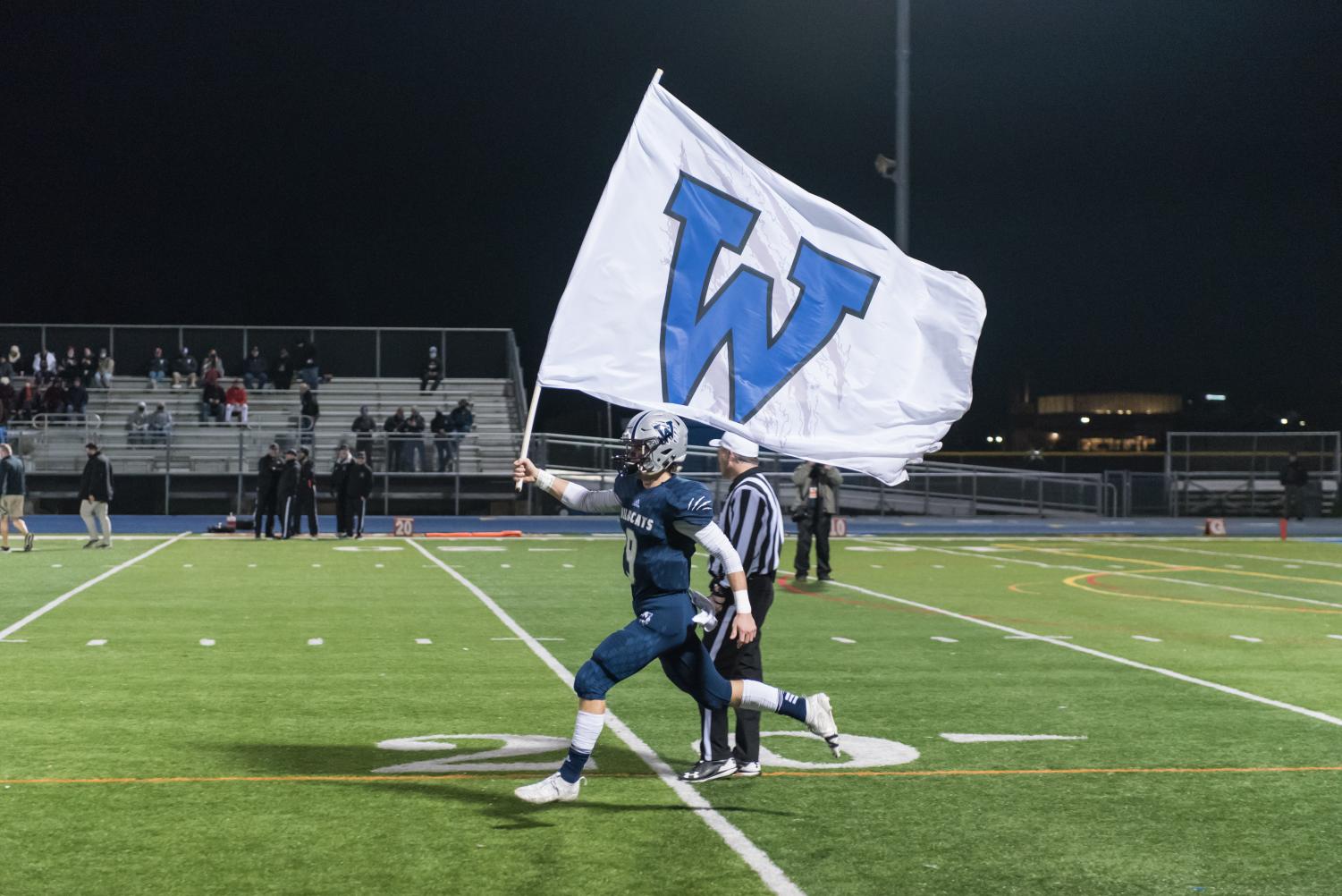 Team spirit is always lifted when the Wildcats fly their flag before a game.