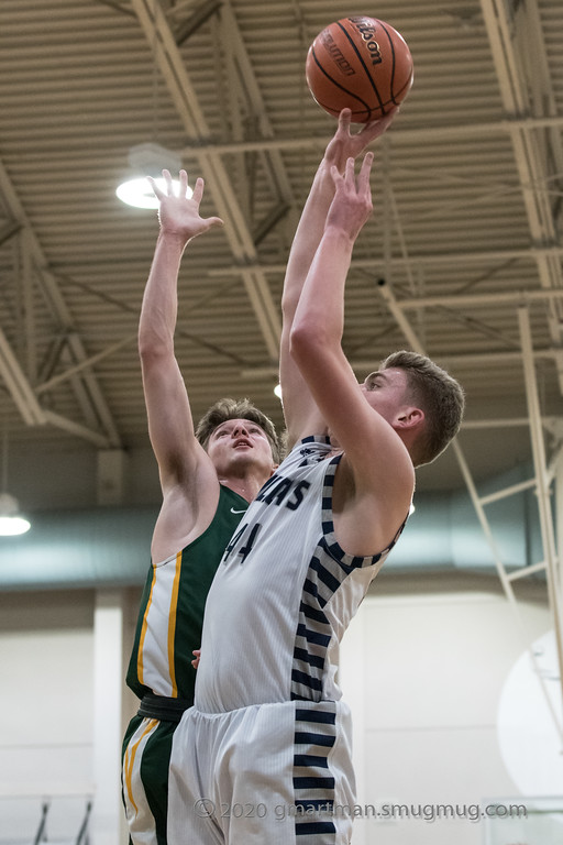 Logan Thebiay puts up a contested shot, needing it to fall. This year the Cats aim to be strong in all aspects of their game, including offense and defense.