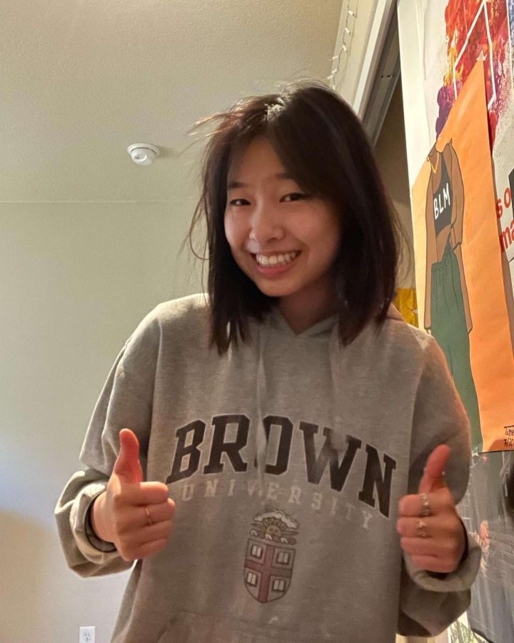 Alyssa+Sun+proudly+poses+with+her+Brown+sweatshirt+on+after+her+acceptance.+Brown+has+an+acceptance+rate+of+only+7%25.