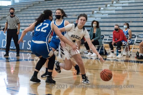 Grace Gatto dribbles through multiple La Salle defenders looking for a bucket.