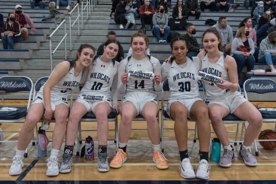 Five Wildcats pose for a photo in between halfs. Team spirit is always high with this team, and, probably has much to do with their many successes.