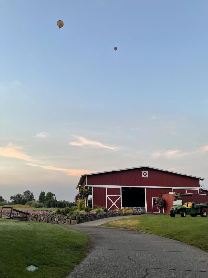 A picture of the red shed at Langdon. Captured by Emma Dougherty on a summer morning. The shed has garage doors that open allowing for events to be hosted indoors and outdoors.