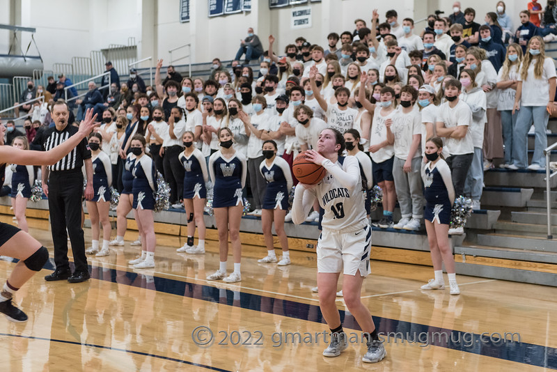 Senior+Grace+Gatto+pulls+up+for+the+three+with+the+support+of+the+student+section.+Wilsonville+had+an+electric+student+section+during+our+home+games.+