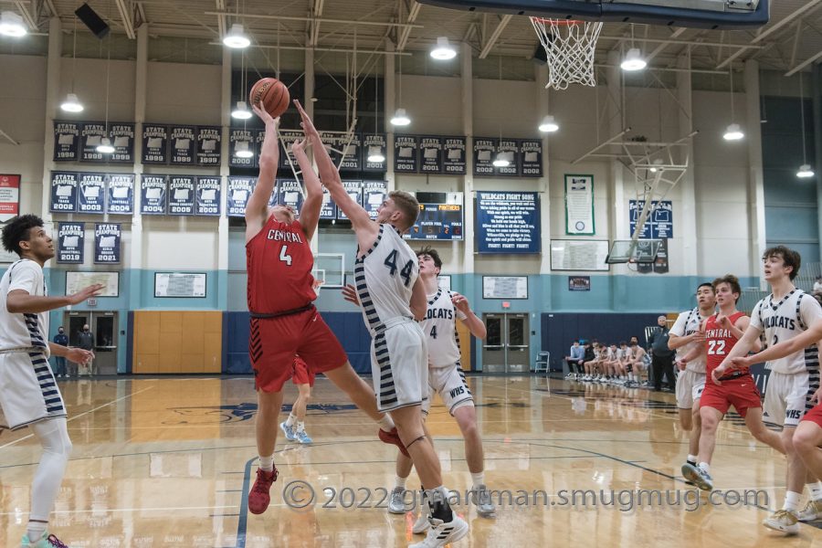 Logan Thebiay defends his basket as Wilsonville beats Central and moves on to the second round.