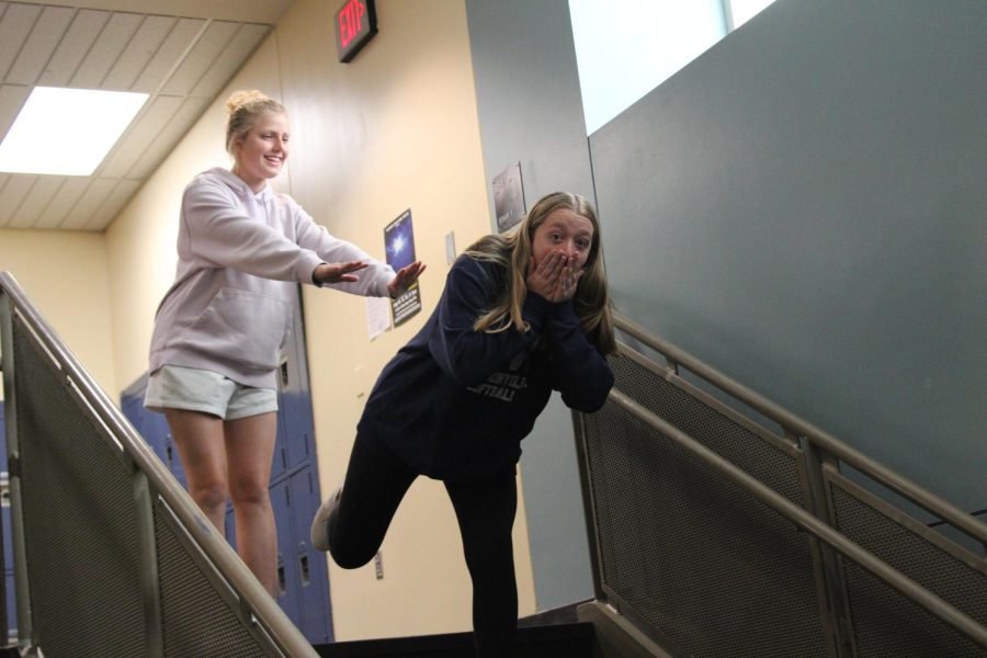 A renactment of a historical moment in the Gore household. Lorianne Servingnat pushes Maddie Holly down the stairs. Captured by Connor Larsen