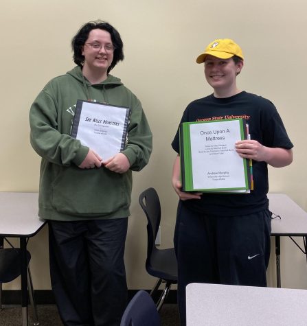 Noah Stanley (left) and Andrew Murphy (right) pose with their presentation binders the day before State. They had gotten together to practice their presentations one final time before the competition.