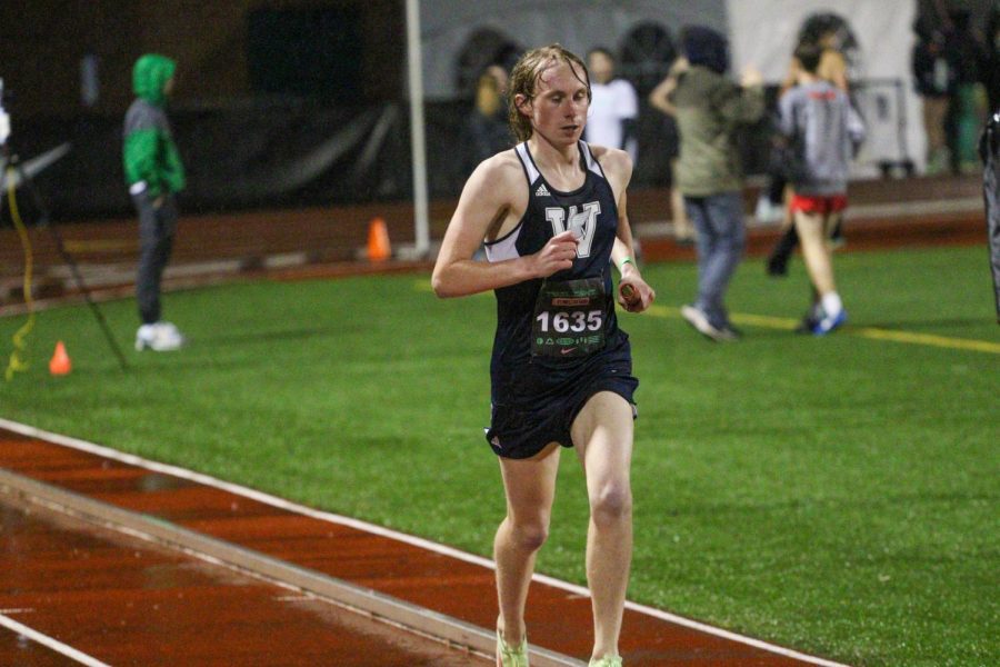 Caden Edwards was the anchor of the varsity 4x800 meter relay team for Wilsonville. Running in the rain is a distance running culture, and Wilsonville thrived in the rain at the meet. 