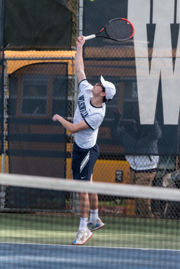 Senior Ben Pinoli hits a serve against Tualatin. Pinoli has had a great performance all season, and it paid off at state.