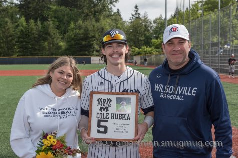 Cole Hubka and his family celebrate senior night at Wilsonville High School. Wilsonville beat Scappoose 3-0.