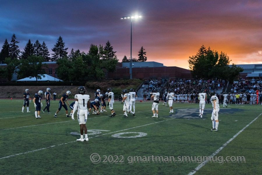 Wilsonville+football+playing+with+the+sunset+behind+them.+Wilsonville+faces+hood+River+at+home+on+Friday+9%2F30.+
