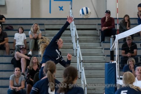Makenna Weipert spikes a ball against Hood River. This play would be a crucial part in a big league win for Wilsonville.