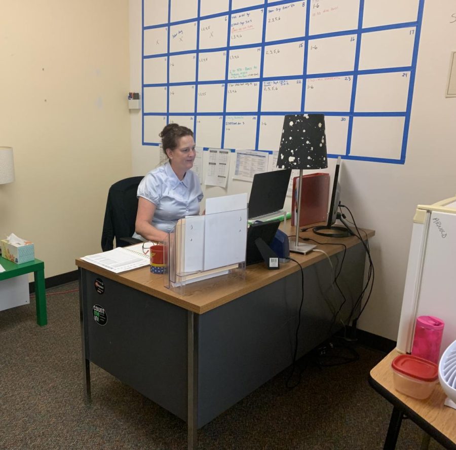 Ms. Arnold works at her desk in Room 98. Her office is located right next-door to the main office.