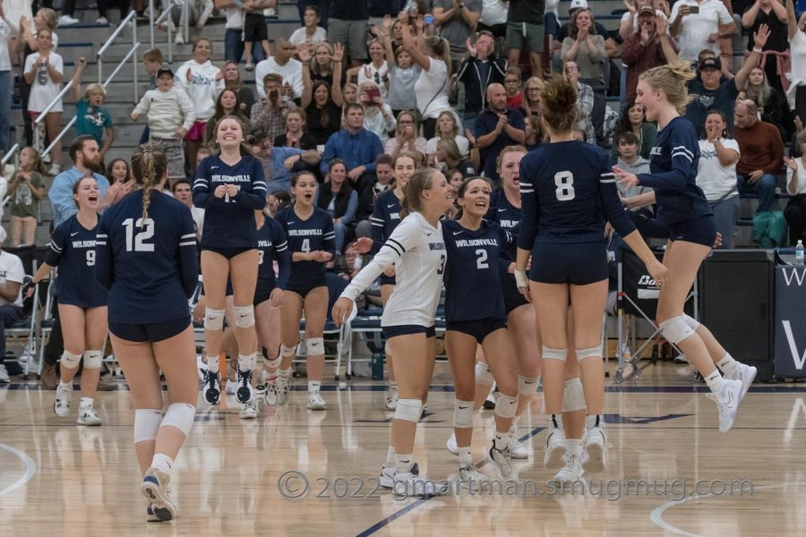 Wilsonville celebrates after beating rival La Salle in a five set thriller. Wilsonville is currently ranked 1st in 5A via OSAA.