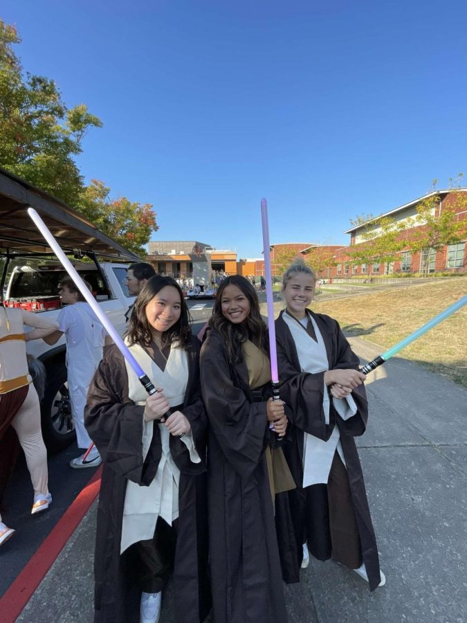 Seniors Anthea Goh, Taylor Hadden, and Fiona Dunn pose in their Star Wars costumes! All three helped to design and build the float this year.