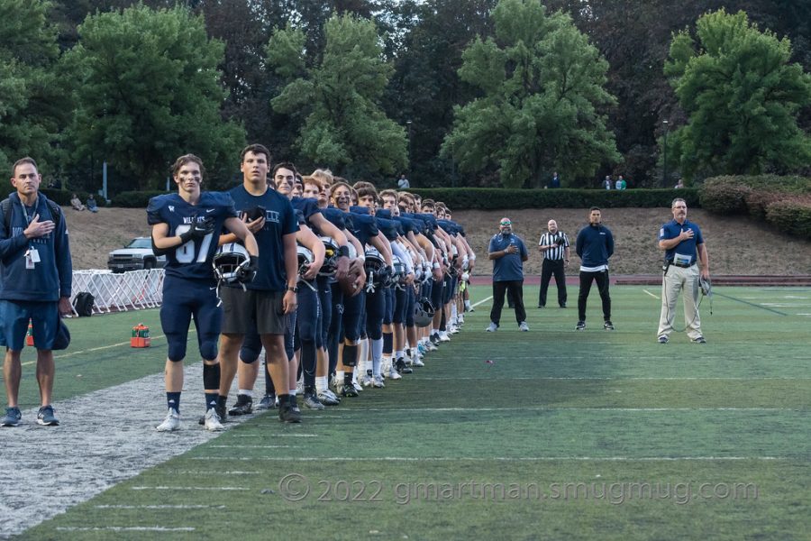 Wilsonville Football lined up for the anthem before a home game. The Wildcats defeated Hood River Valley 52-6