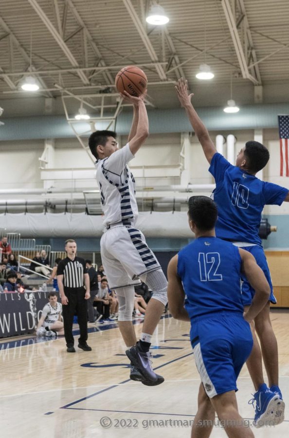Senior Maxim Wu going for two points. Wilsonville became the WIL champions last year.