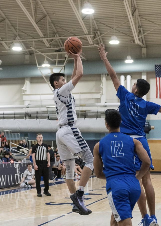 Senior Maxim Wu going for two points. Wilsonville became the WIL champions last year.