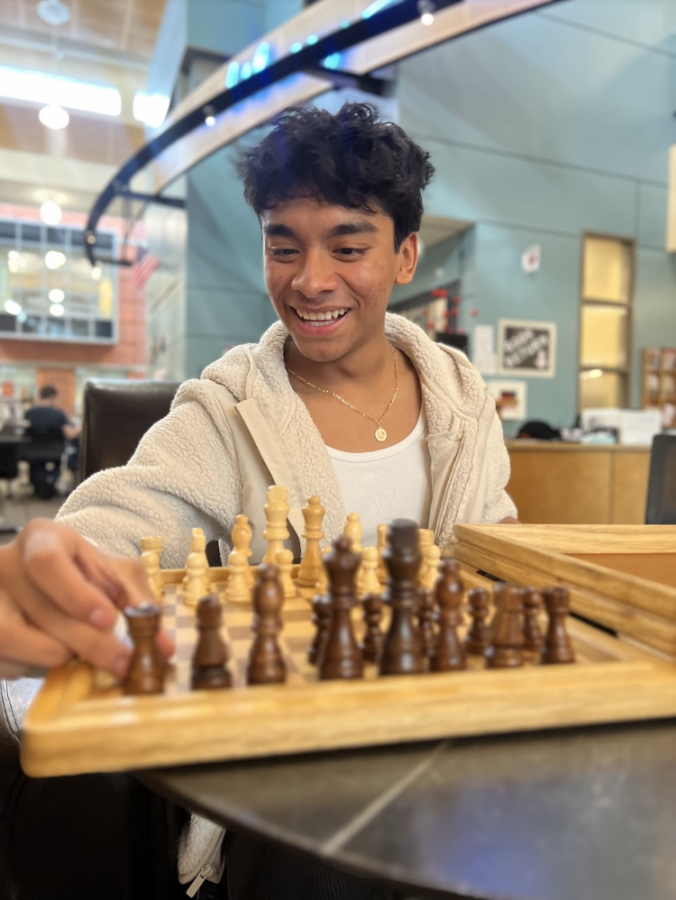  Anthony Herrera takes a break from class to play a quick game of chess. Students often find peace during their hectic day in the schools library.