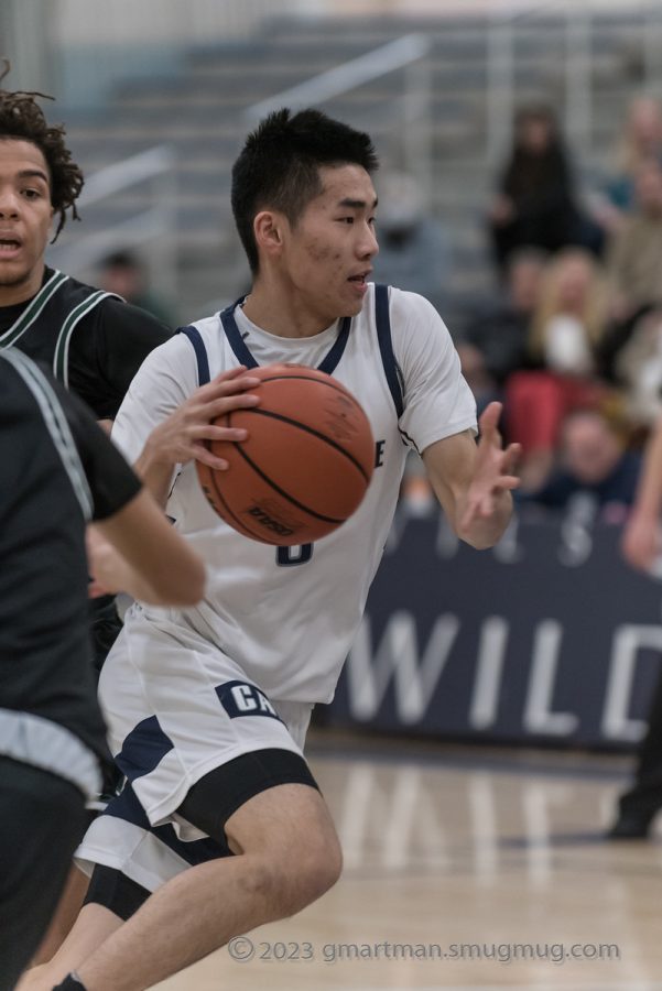 Senior Maxim Wu drives to the basket vs Parkrose. Wilsonville takes on Milwaukie on the road Friday, February 10th at 5:45 PM.
