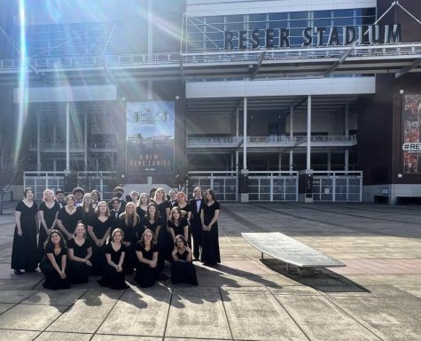 Wilsonville symphonic choir is posing for a picture outside of Reser Stadium at OSU after their first choir competition of the year.
