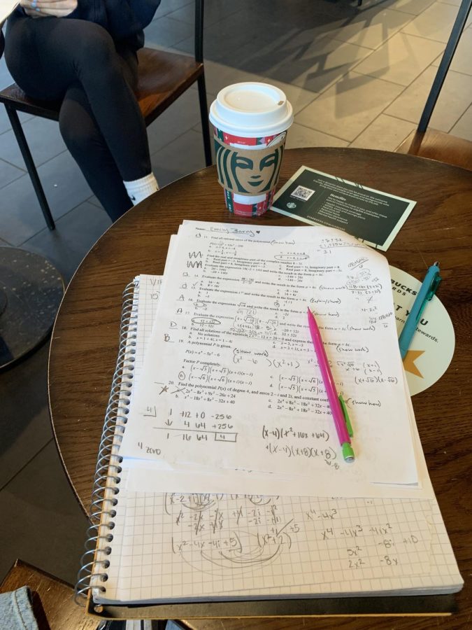 Students+have+plenty+of+space+to+lay+out+their+work+at+Starbucks.+Coffee+seems+to+be+the+drink+of+choice+by+students