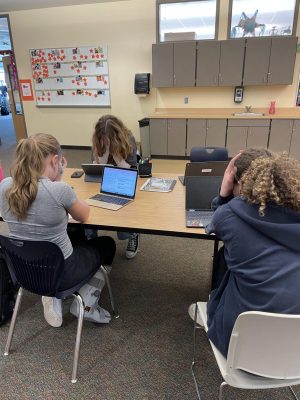 Abbie Memmott (left), Reese Buchanan (center), and Mia Poppe (right), all juniors scrounge together the motivation to work on their projects. They are feeling the strain of a long school day and lots of focused effort.