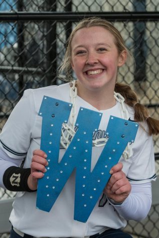 Maddie Holly celebrates a Wildcat homerun with the bedazzled homerun chain. With contributions from every player, the Cats were able to take home the win.