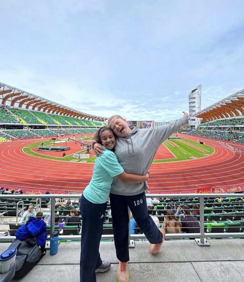 Juniors Avery Devincenzi and Kiera Easterly posing at Hayward Field in Eugene. They both competed at Oregon Relays.